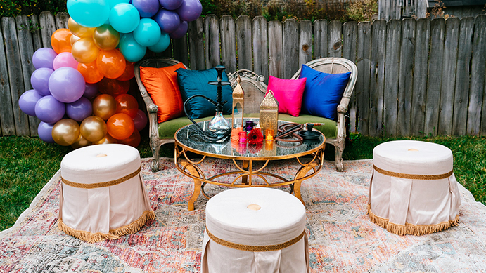 Lounge grouping, vignette, styling, event style, photo op, photo backdrop, event seating, Moroccan styling, theme event, balloon arch, balloon decor, fringe