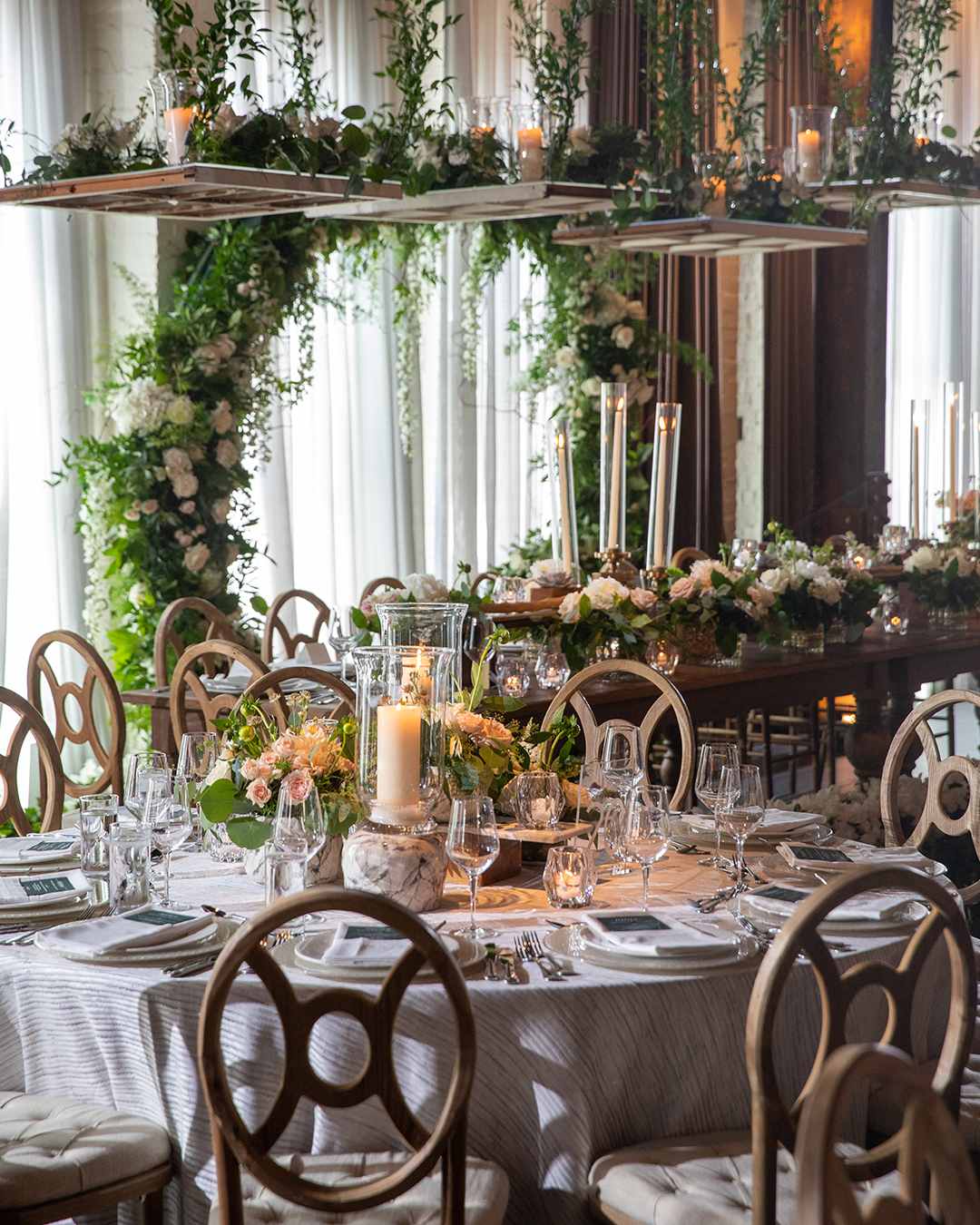 Garden-Inspired, Centerpiece, Wedding Centerpiece, Floral Arrangements, Flowers, Greenery, Plantscapes, Chandeliers, Romantic, Brides, Pride Month, Intimate Wedding, Secret Garden, Wedding Reception, Tablescape, Floral Designs